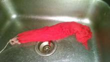 Red yarn in sink